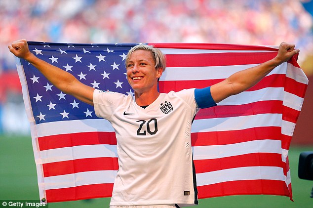 Abby_Wambach_brandishes_a_Star_Spangled_Banner_with_glee_after_c-a-39_1436157590942