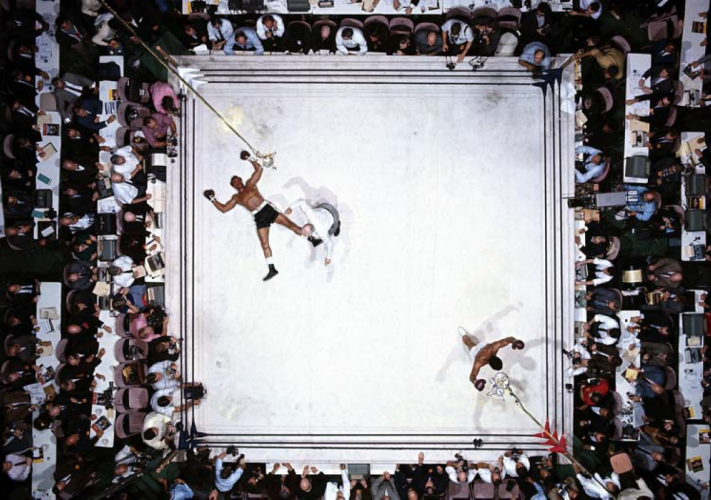 Aerial view of Muhammad Ali victorious after round 3 knockout of Cleveland Williams during fight at Astrodome 1966